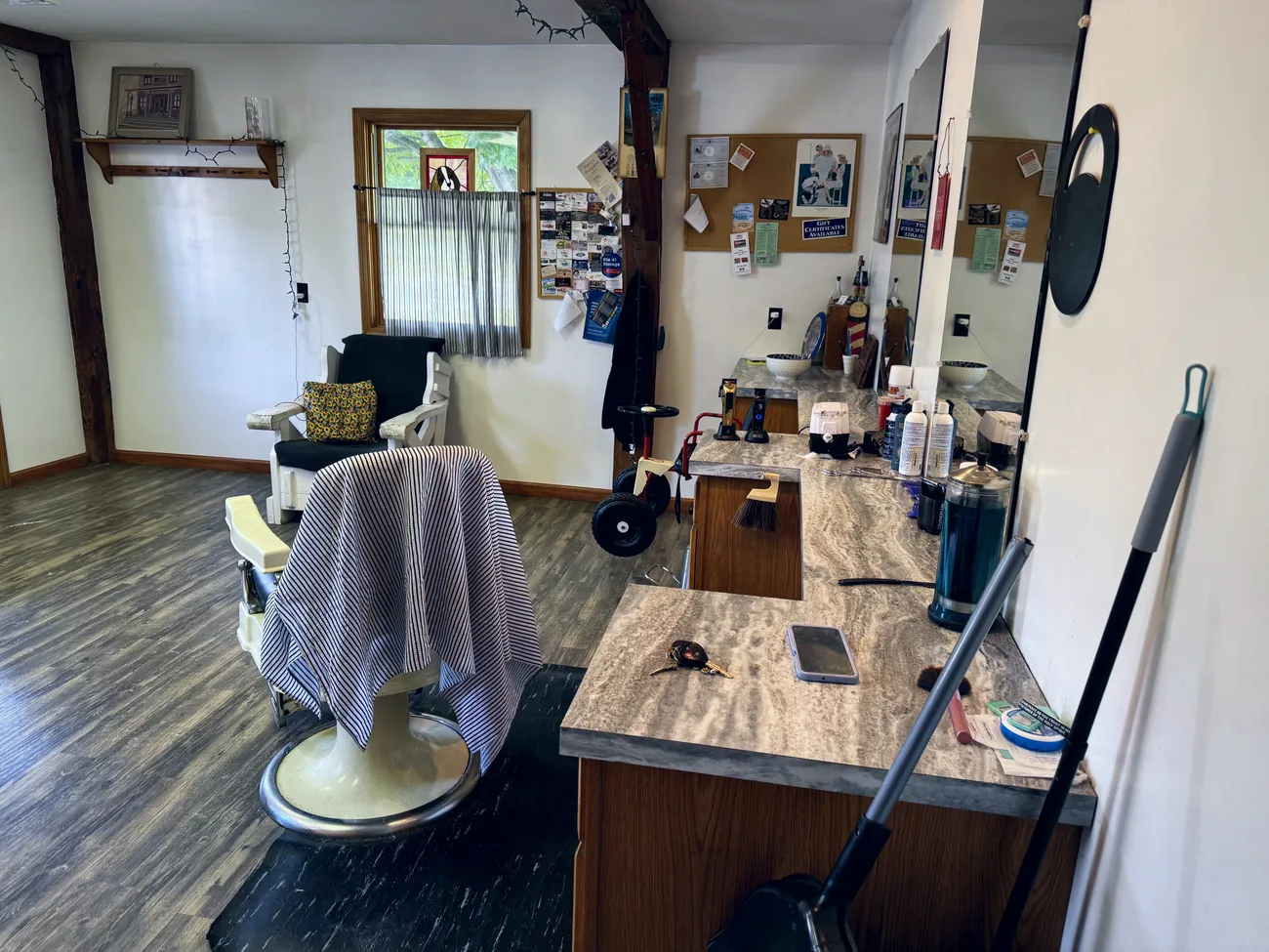 The vintage barber chair and tool counter inside the shop.